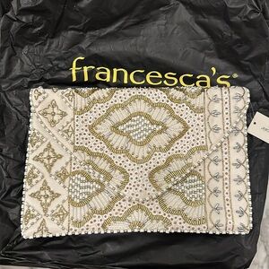 Francesca’s white/gold beaded clutch